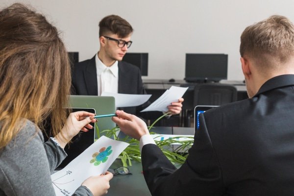 a group of people sitting around a table