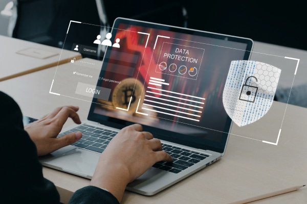 a person typing on a laptop