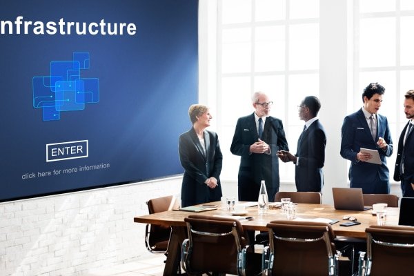 a group of people standing around a table