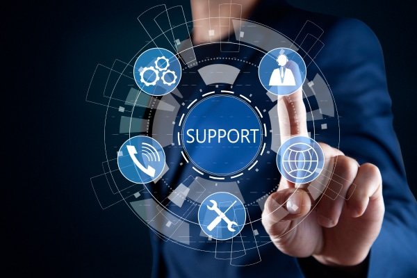 a person touching a screen with icons